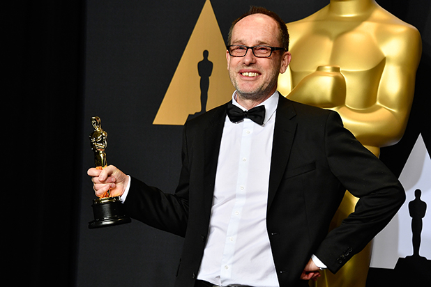 Editor John Gilbert, winner of Best Film Editing for 'Hacksaw Ridge' poses in the press room during the 89th Annual Academy Awards